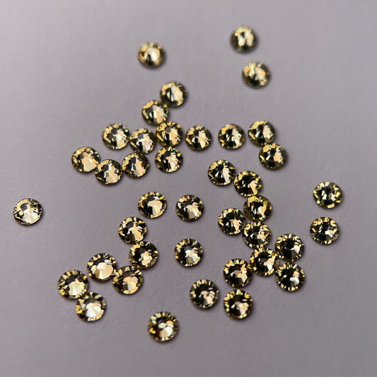 Strass dentaire Swarovski rond, couleur citron, éclat cristallin.