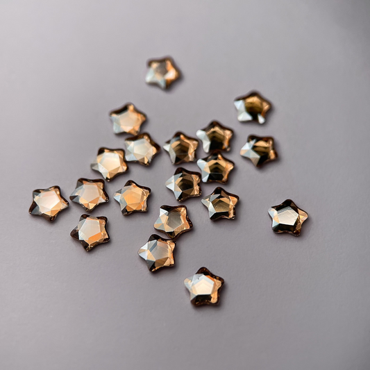 Strass dentaire Swarovski en forme de petite étoile, couleur champagne, haute brillance, qualité professionnelle.