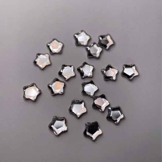 Strass dentaire Swarovski en forme de petite étoile, couleur crystal, haute brillance, qualité professionnelle.